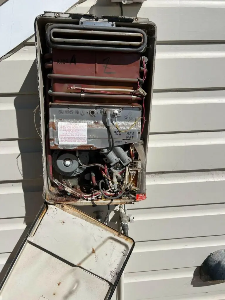 Continuous flow hot water unit opened up for repair